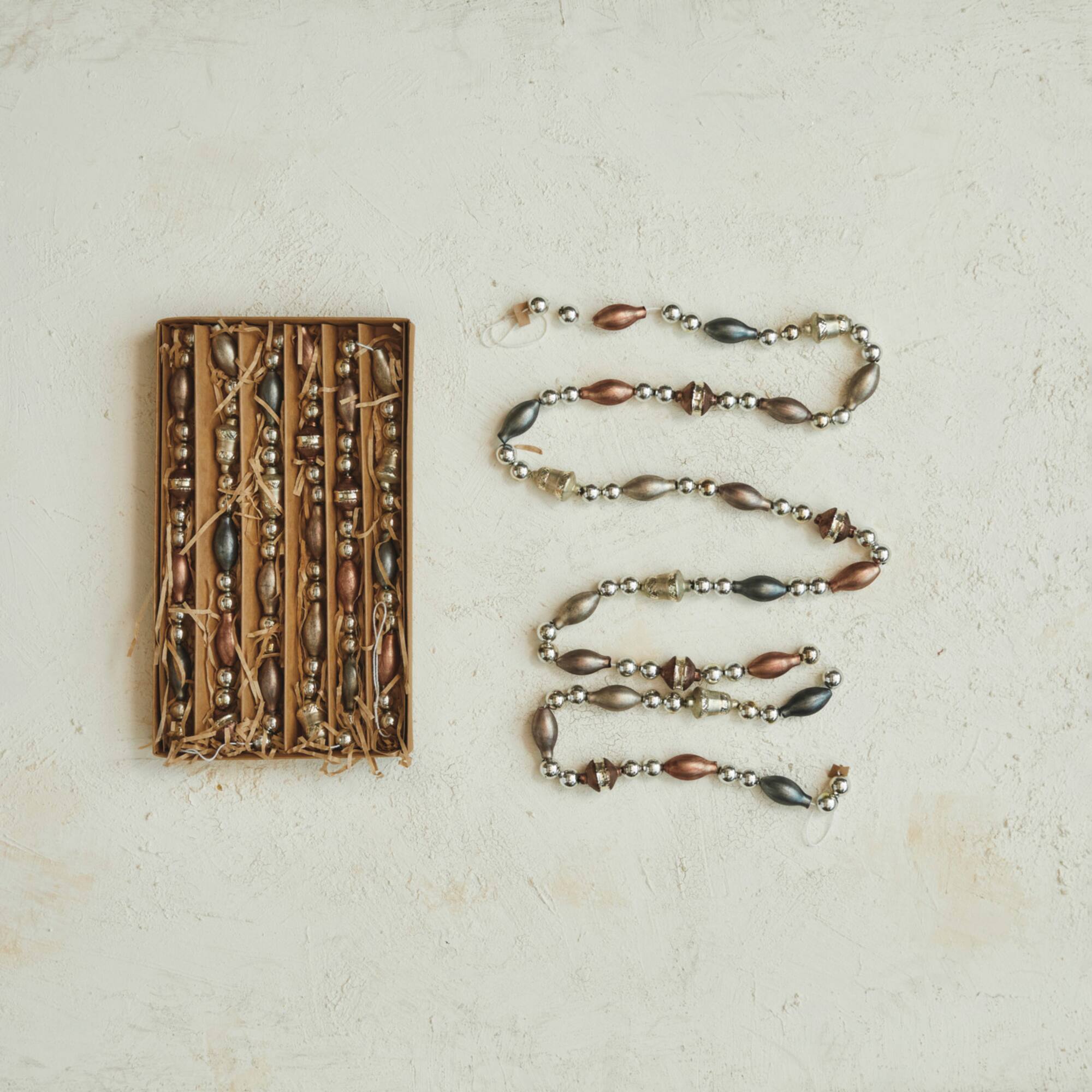 Hello Honey® 6ft. Antique Metallic Glass Garland in Kraft Box